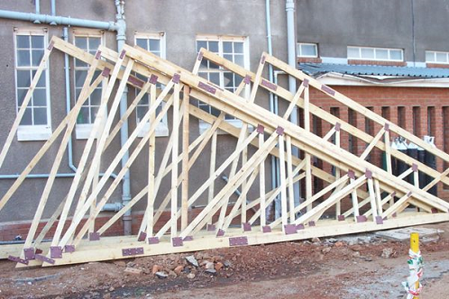 at_hosp_materdei_fire_2005_rebuild_roof_trusses_ready.png